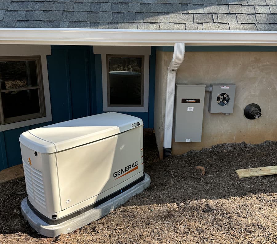 Generac home generator installed beside house with electrical panel for backup power.